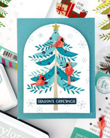 Handmade greeting card with a Christmas tree on it with Season's Greetings sentiment on it.