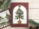 Handmade greeting card with a Christmas tree on it with merry christmas sentiment on it.