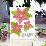 Handmade greeting card with flowers on it and season's greetings sentiment on it.