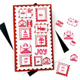 Handmade greeting card with Christmas postage stamps on it and joy sentiment on it.