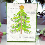 Handmade greeting card with a Christmas tree on it and candles with all is calm, all is bright, to you and yours sentiment on it.
