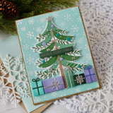 Handmade greeting card with Christmas tree on it and merry Christmas sentiment on it.