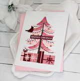 Handmade greeting card with Christmas tree on it and season's greetings sentiment on it.