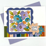 Handmade greeting card with flowers on it and love you sentiment on it.