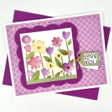 Handmade greeting card with flowers on it and love you sentiment on it.