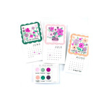 Three handmade calendars with flowers on each.