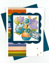 Handmade greeting card with flowers on it and miss you sentiment on it.