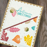 Handmade greeting card with leaves on it and autumn greetings sentiment on it.