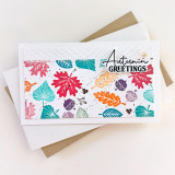Handmade greeting card with leaves on it and autumn greetings sentiment on it.
