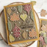 Handmade greeting card with autumn leaves on it and autumn greetings sentiment on it.
