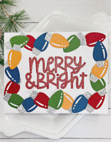 Handmade greeting card with Christmas lights on it and merry & bright sentiment on it.