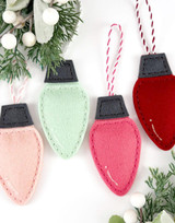 Felt light bulbs that are made into ornaments for holiday decoration.