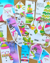 A lot of handmade greeting tags with santa, snowmen, ornaments, and mittens on them.