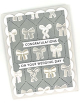 Handmade greeting card with bows on it and congratulations on your wedding sentiment on it.