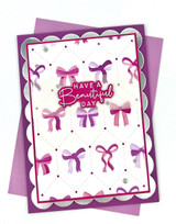 Handmade greeting card with bows on it and have a beautiful day sentiment on it.