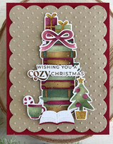 Handmade greeting card with books on it and presents with wishing you a cozy Christmas sentiment on it.