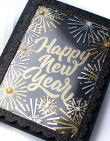 Handmade greeting card with fireworks on it and happy new year sentiment on it.