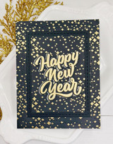 Handmade greeting card with sparkles on it and happy new year sentiment on it.