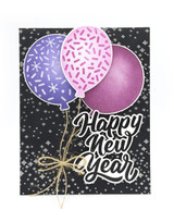 Handmade greeting card with balloons on it and happy new year sentiment on it.