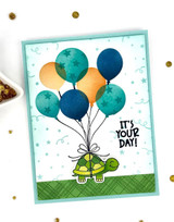 Handmade greeting card with turtle and balloons on it with it's your day sentiment on it.