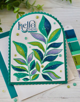 Handmade greeting card with leaves on it and hello there sentiment on it.