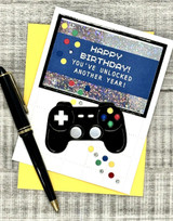 Handmade greeting card with a gaming controller on it and happy birthday! you've unlocked another year sentiment on it.