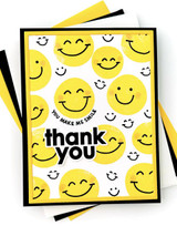 Handmade greeting card with smiley faces on it and thank you sentiment on it.
