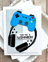 Hanndmade greeting card with gaming controller and headset on it with you're a winner sentiment on it.