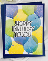 Handmade greeting card with balloons on it and happy birthday to you sentiment on it.