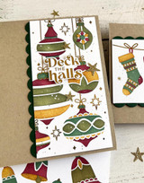 Handmade greeting card with ornaments on it and deck the halls sentiment on it.