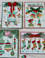 Four handmade greeting cards with various holiday items on it with different holiday sentiments on each.