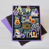 Handmade greeting card with halloween town on it and haunted hello sentiment on it.