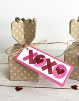 Handmade gift box with xoxo on a tag on it.