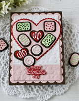Handmade greeting cards with a heart on it and chocolate hearts in the heart with happy valentine's day sentiment on it.