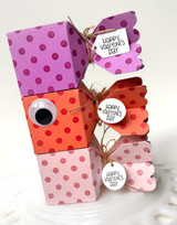 Three handmade gift boxes with happy Valentine's Day on each.