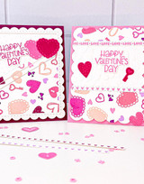 Two handmade greeting cards with hearts and keys on each with happy valentine's day sentiments on each.
