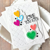 Handmade greeting card with hearts on it and love you lots sentiment on it.