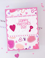 Handmade greeting card with hearts on it and happy valentine's day sentiment on it.