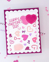 Handmade greeting card with hearts and keys on it with happy valentine's day sentiment on it.