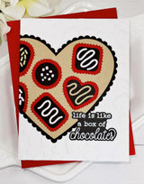 Handmade greeting card with heart with chocolates on it and life is like a box of chocolates sentiment on it.