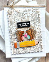 Handmade greeting card with two hedgehogs on it and you make me smile sentiment on it.