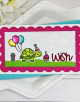 Handmade greeting card with turtle on it with balloons and presents with wish sentiment on it.
