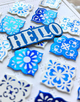 Handmade greeting card with tiles on it and hello sentiment on it.