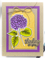 Handmade greeting card with flowers on it and thinking of you sentiment on it.