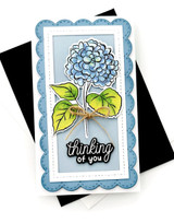 Handmade greeting card with flowers on it and thinking of you sentiment on it.