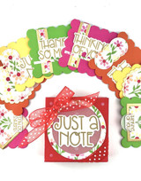 Various handmade greeting boxes with flowers and different sentiments on each.