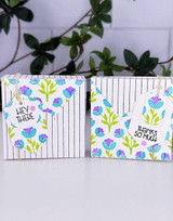 Two handmade gift boxes with flowers on each.