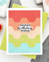 Handmade greeting card with hexagons on it and belated birthday wishes sentiment on it.