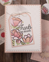 Handmade greeting card with flowers on it and thanks so much sentiment on it.