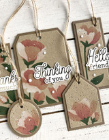 Handmade greeting tags with flowers on it and various sentiments on it.